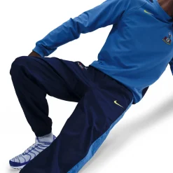 Nike Tottenham Hotspur Total 90 Trainingsbroek Woven 2025-2026 Donkerblauw Blauw Felgeel