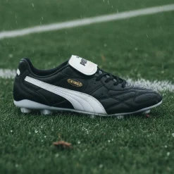 PUMA King Top IJzeren-Nop Voetbalschoenen (SG) Zwart Wit Goud